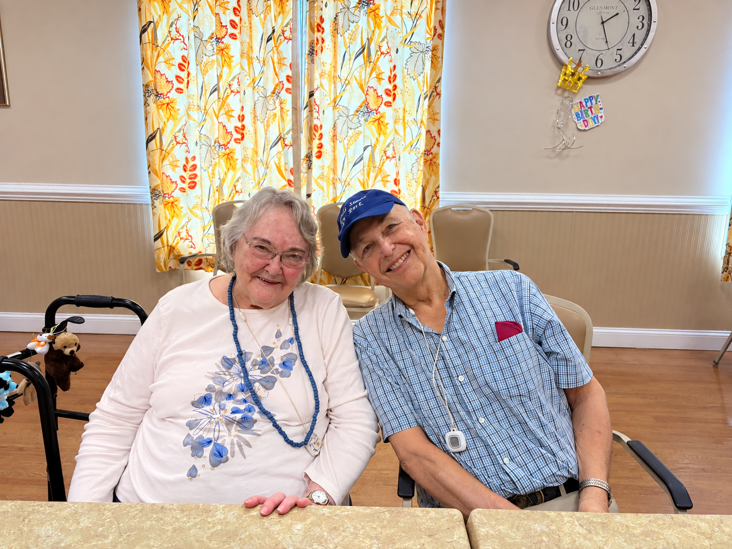 Two residents smiling together at The Woodland in Farmville, Virginia