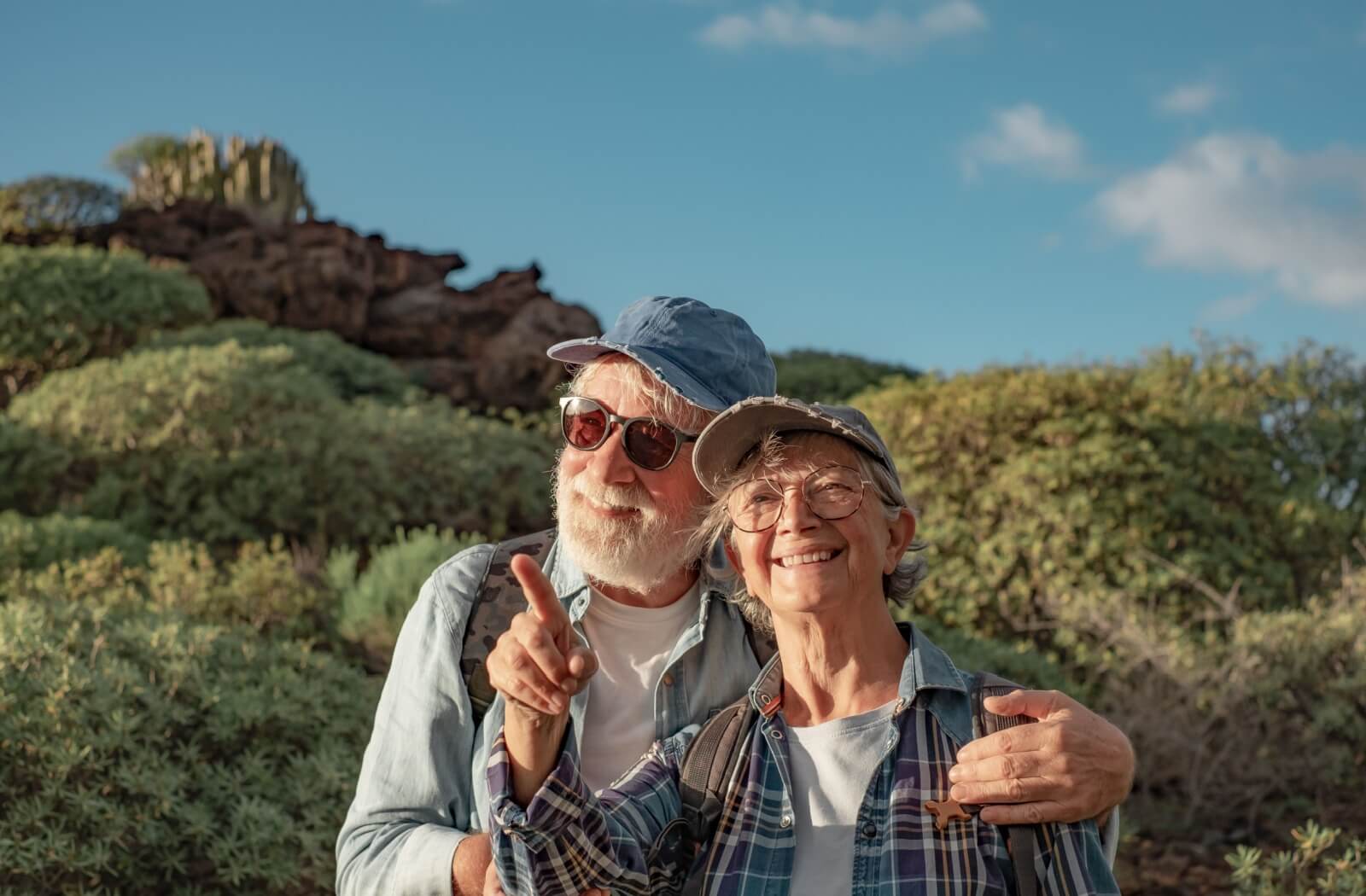 senior couple hiking and looking happy in the nature
